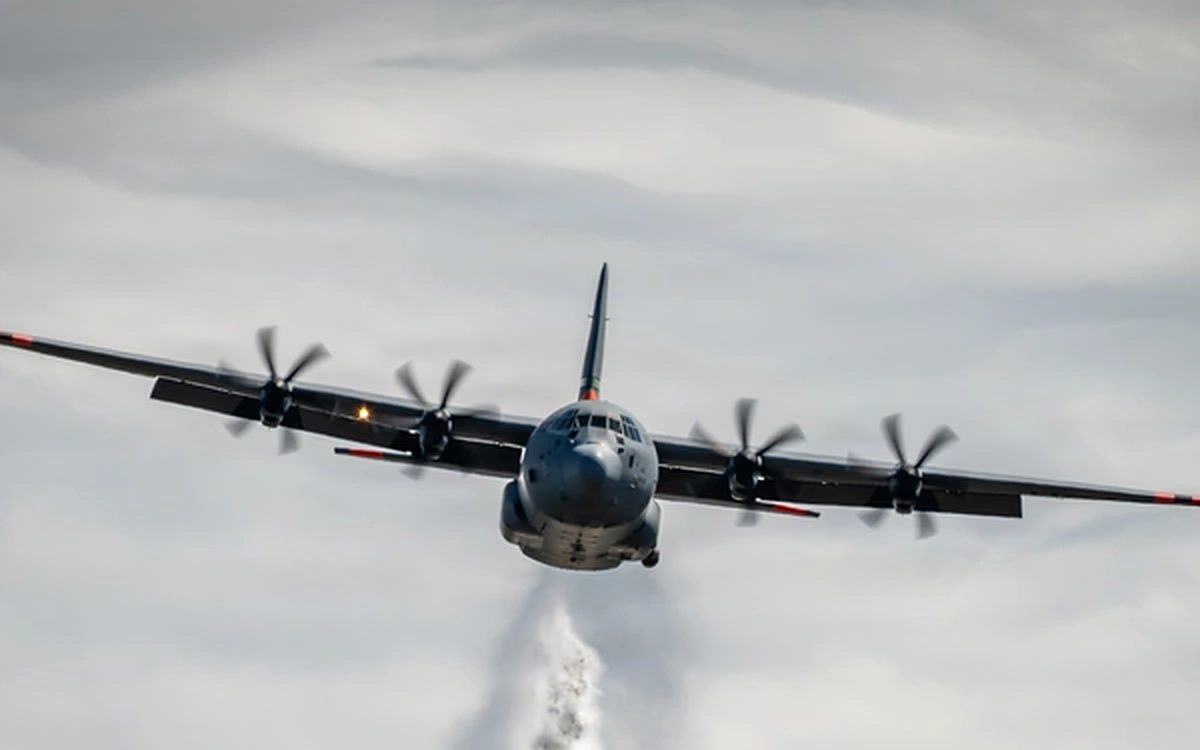 C-130J transport aircraft in flight, seen head-on
